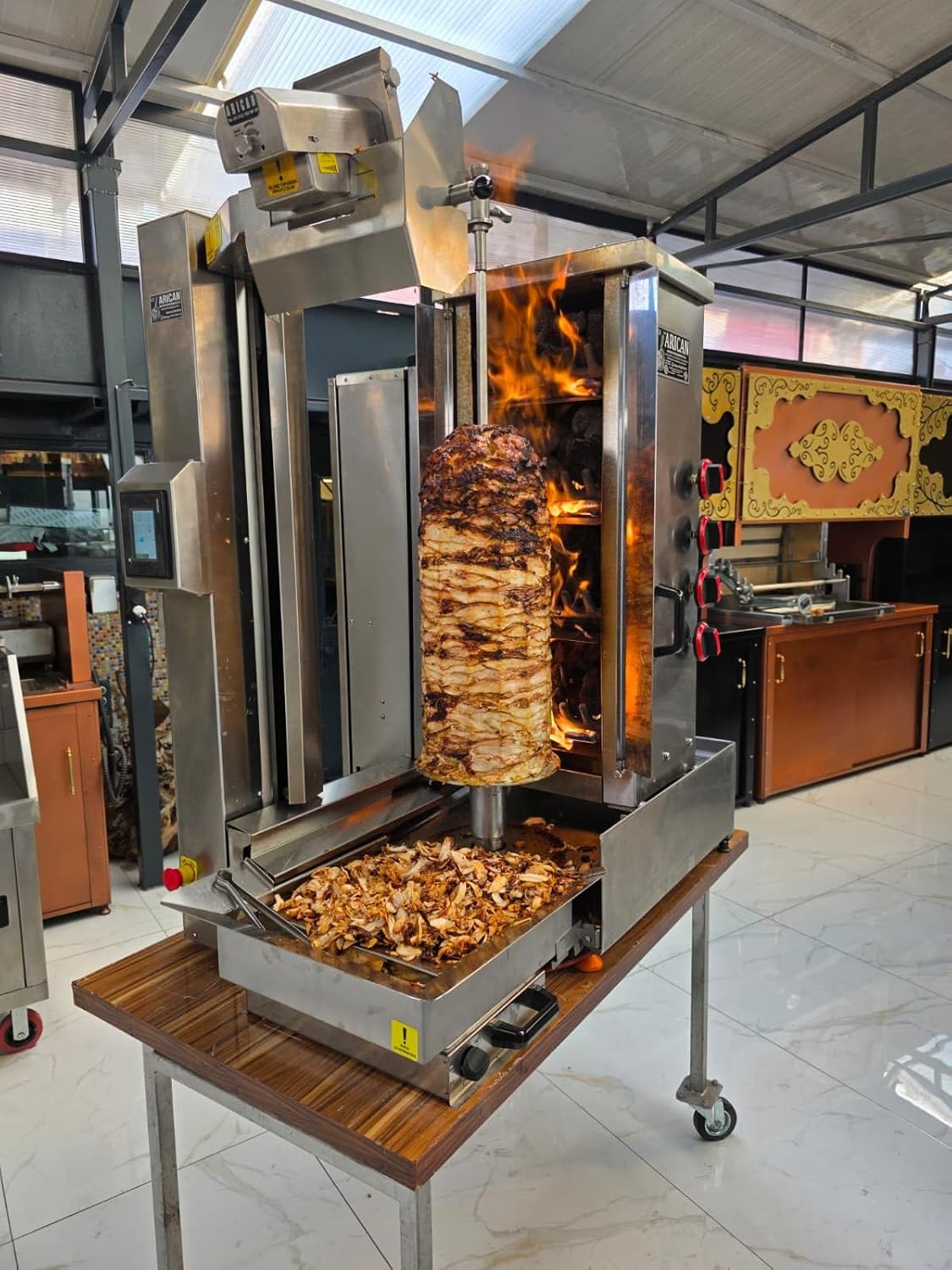 Unboxing the Arican Robot Shawarma machine, showing all components including the main unit, grill assembly, and tools, highlighting the complete package for a new buyer.